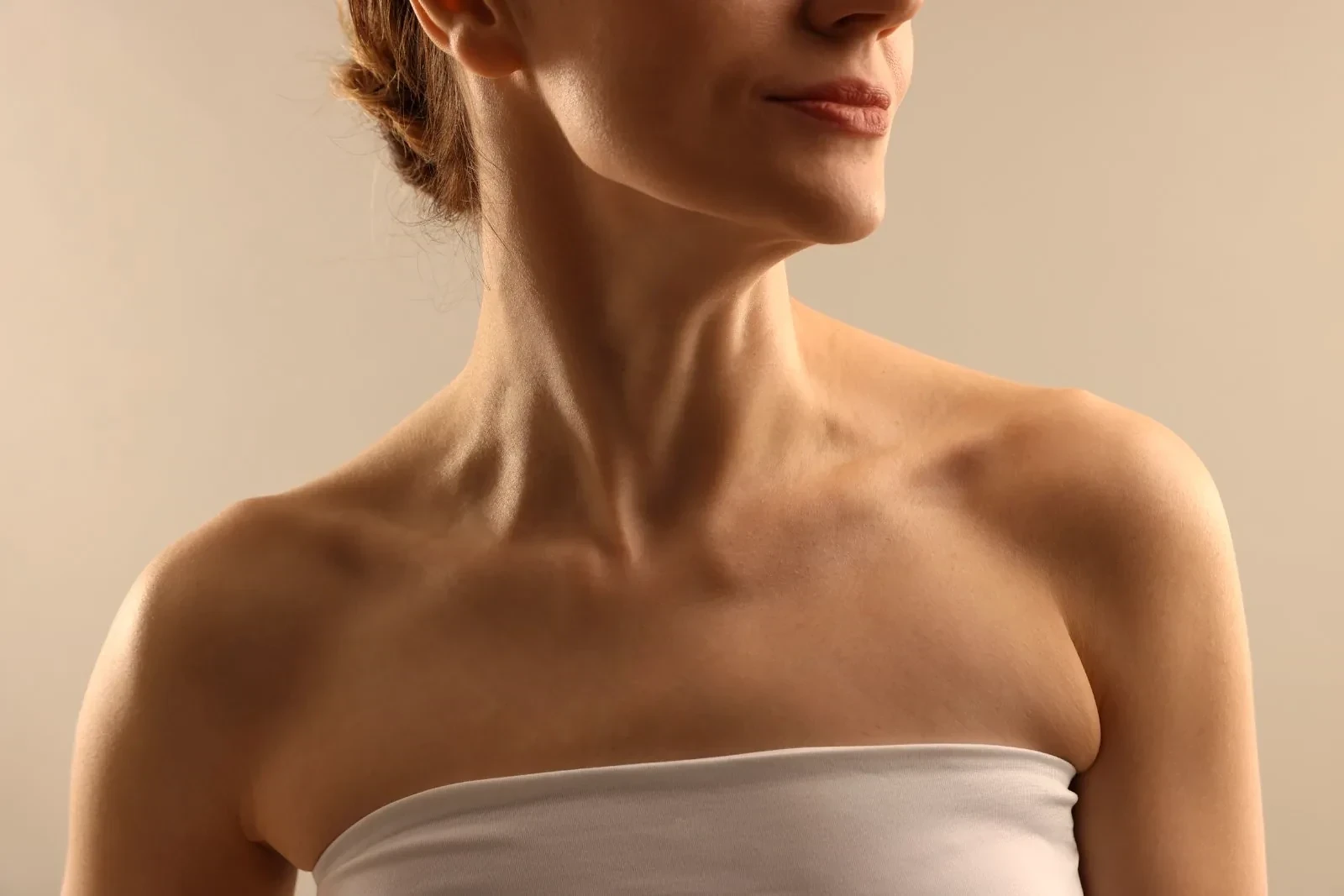 Mature woman's neck and décolletage skin, Body Dezign House Newstead Brisbane
