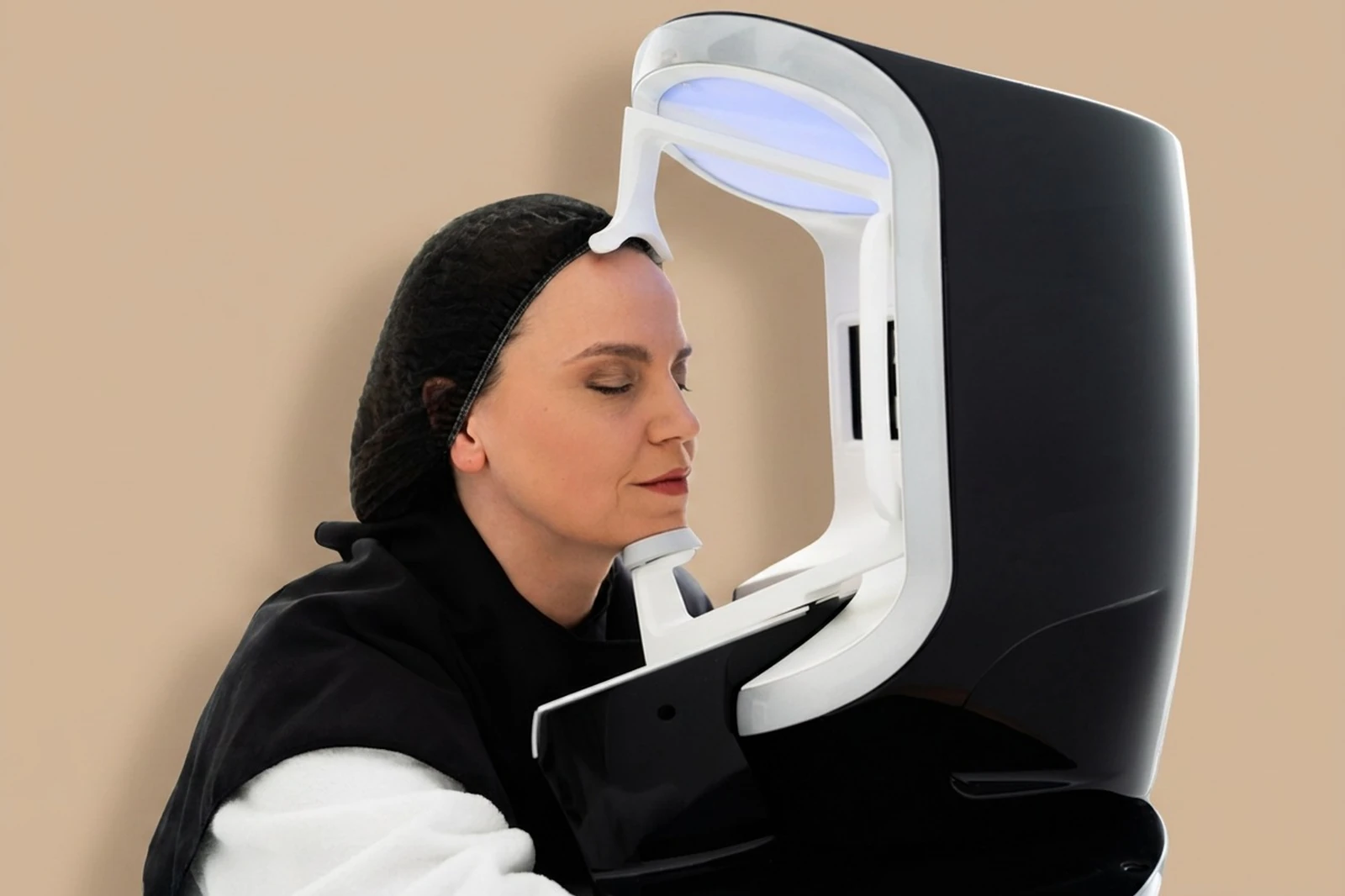Client undergoing VISIA skin analysis in the VISIA imaging booth at Body Dezign House, Newstead Brisbane